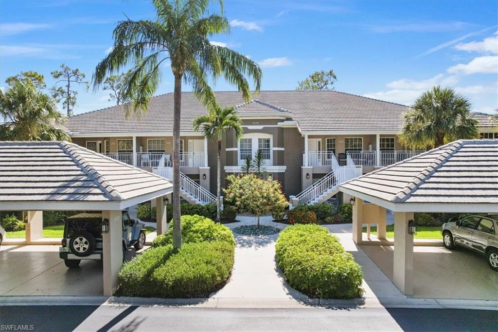 a view of house with outdoor space and swimming pool