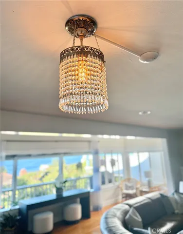 a view of a bedroom with furniture and wooden floor
