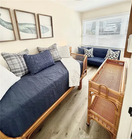 a bedroom with bed and a window