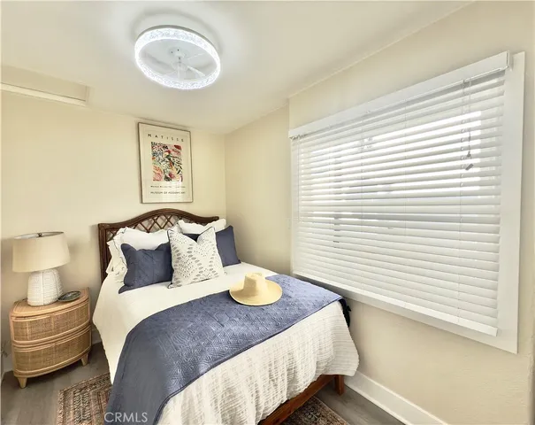 a bathroom with a sink toilet a mirror a vanity and bathtub