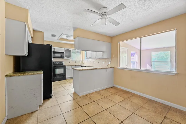 a view of cabinets and window