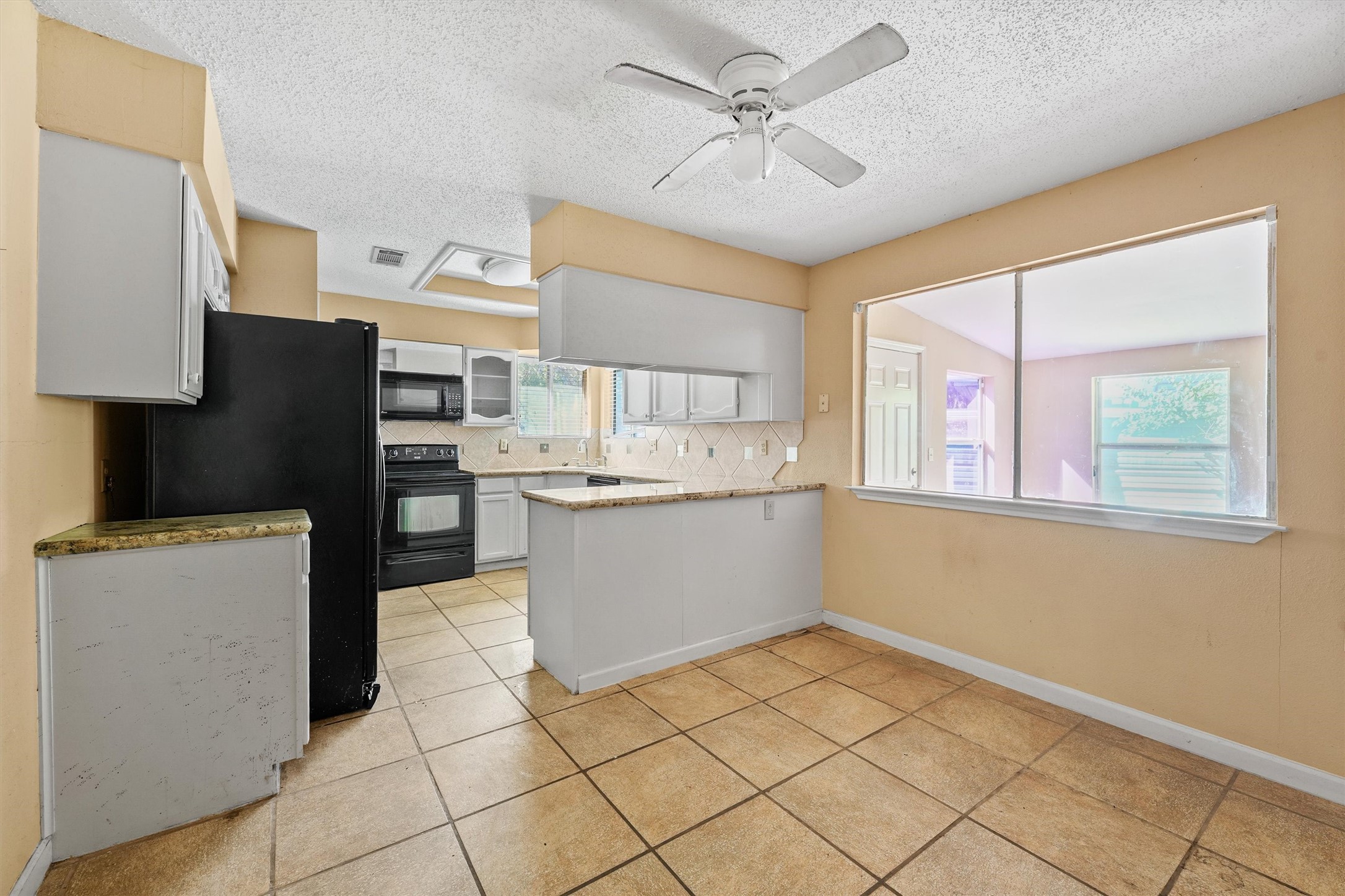 11211 Early Spring Circle Houston, TX 77064 - Photo 12 of 31 a view of cabinets and window