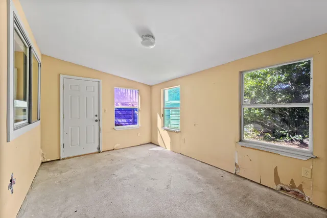 a view of an empty room with a window