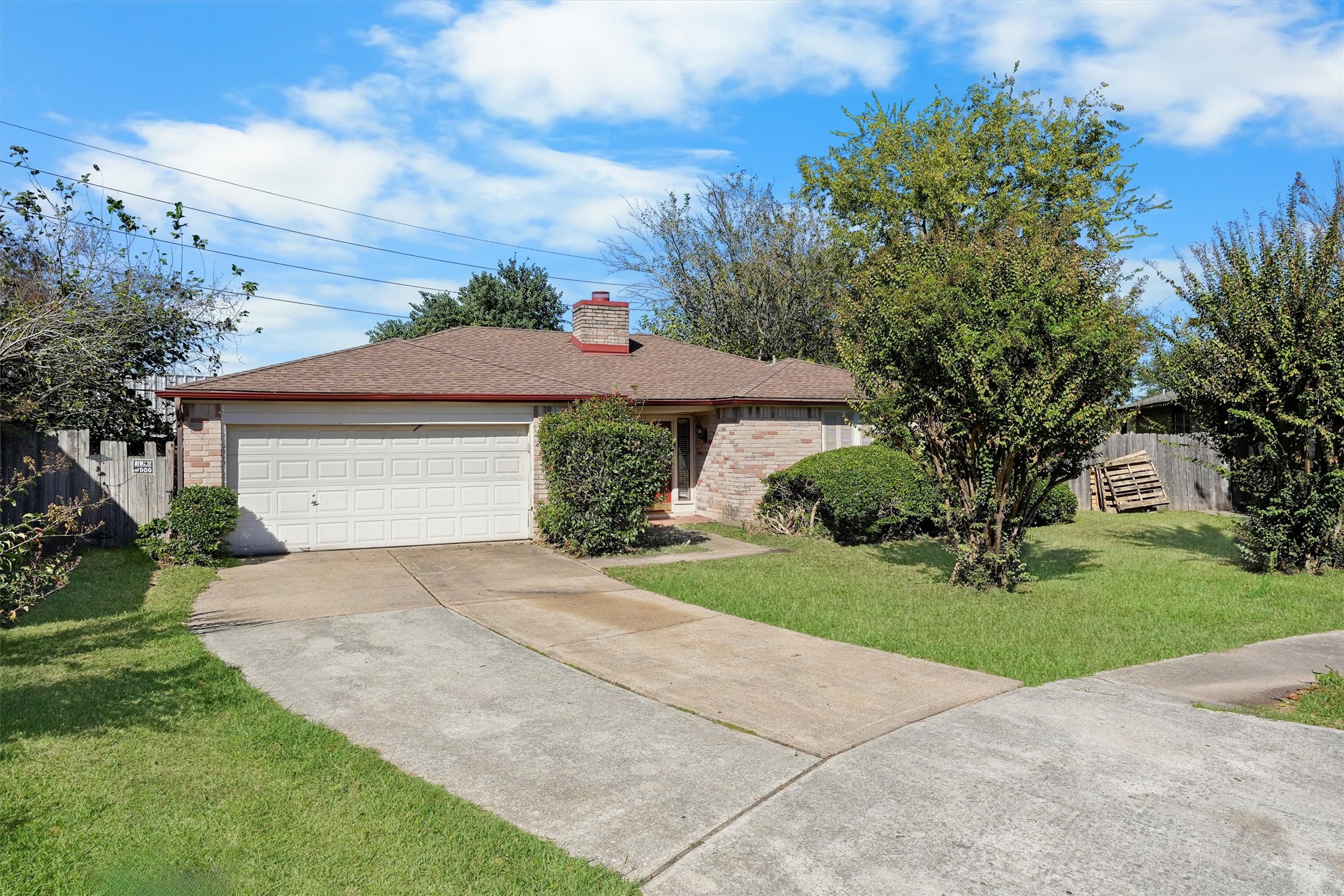 11211 Early Spring Circle Houston, TX 77064 - Photo 2 of 31 a front view of a house with a yard and garage