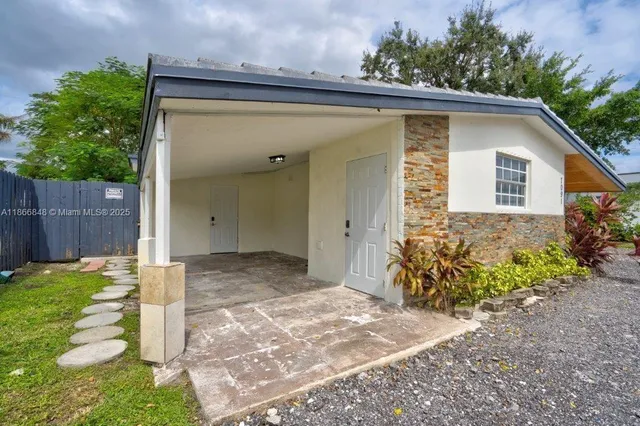 a view of a backyard with plants