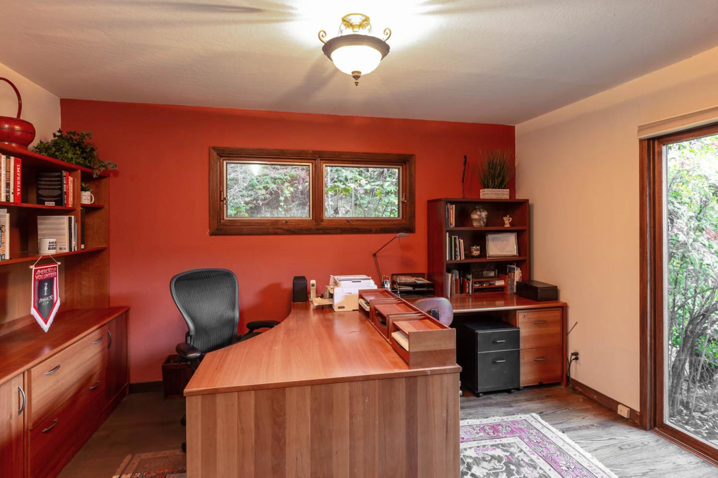 1255 La Honda Road Woodside, CA 94062 - Photo 15 of 26 a room with furniture a bookshelf and a window