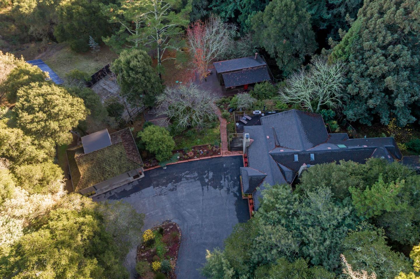 1255 La Honda Road Woodside, CA 94062 - Photo 2 of 26 an aerial view of a house with a garden and lake view