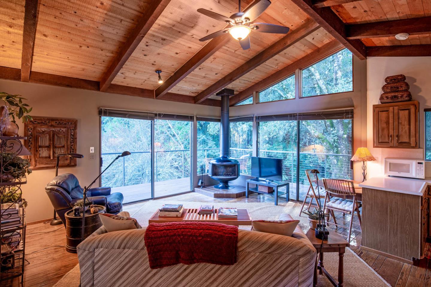 1255 La Honda Road Woodside, CA 94062 - Photo 21 of 26 a living room with furniture a floor to ceiling windows and a table