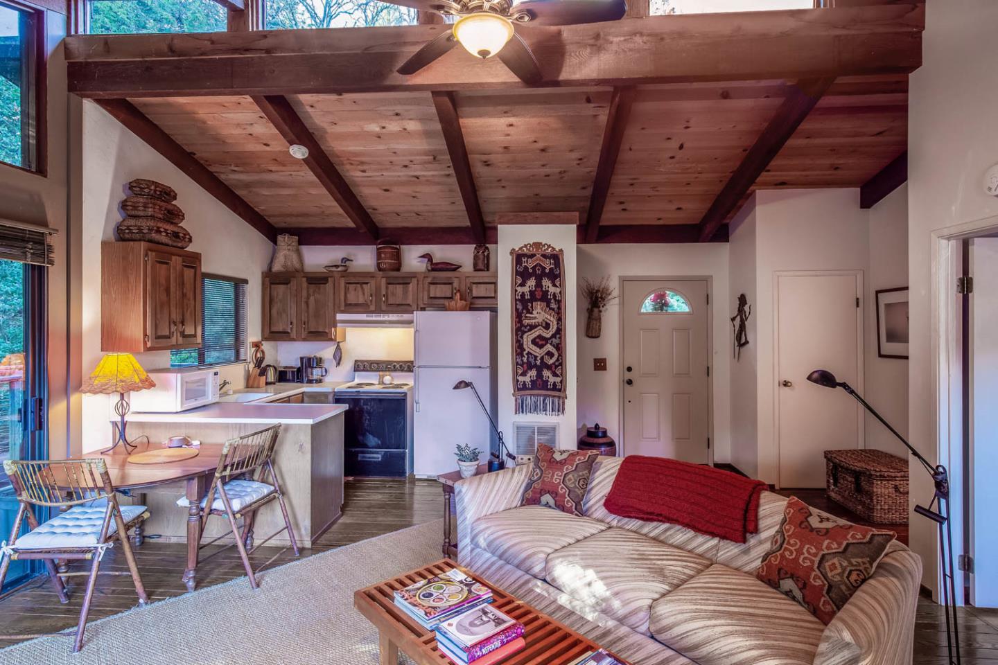 1255 La Honda Road Woodside, CA 94062 - Photo 22 of 26 a living room with furniture a rug and a chandelier
