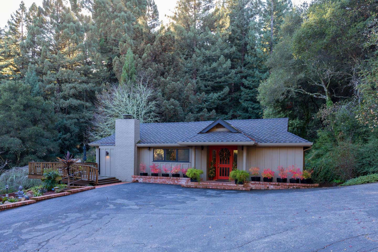 1255 La Honda Road Woodside, CA 94062 - Photo 7 of 26 a view of a house with a patio and a yard
