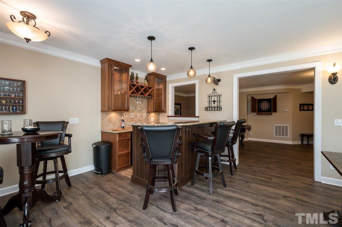 3100 Pyxis Court Raleigh, NC 27614 - Photo 14 of 30 Wet bar, snack and serving bar in the finished basement. Wine glass storage, mini refrigerator, and sink.