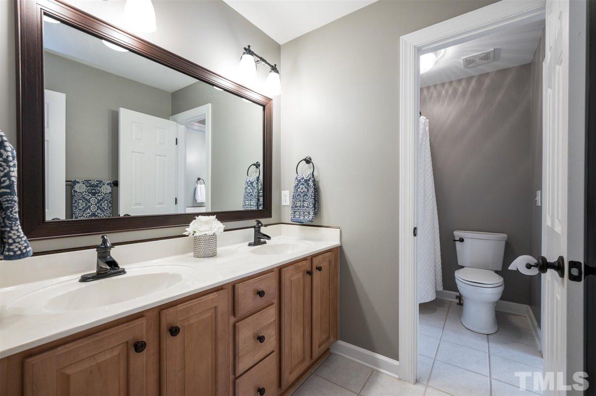 3100 Pyxis Court Raleigh, NC 27614 - Photo 21 of 30 This bathroom is upstairs and has 3 sinks. Dual sink basins in this area. And the separate sink serves Bedroom 4.