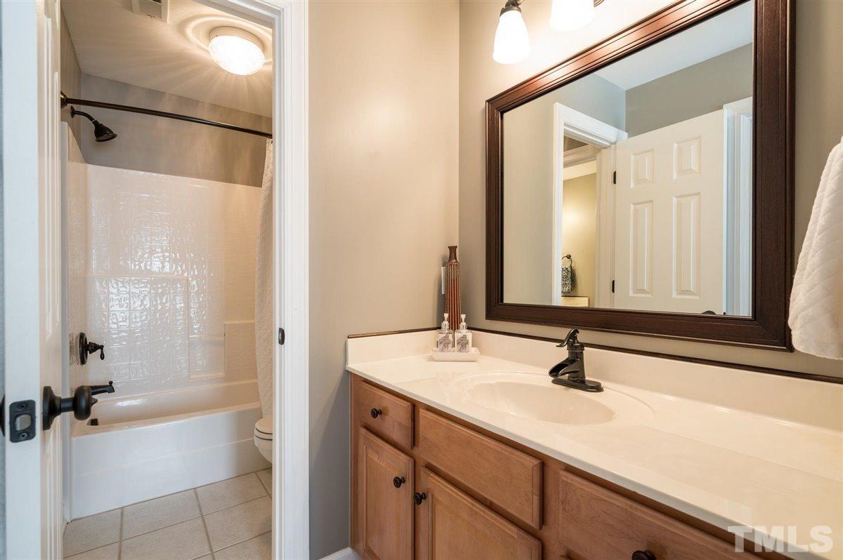 3100 Pyxis Court Raleigh, NC 27614 - Photo 22 of 30 The other angle of this bath and a half is shown here with the single basin sink and long countertop, plus the bath/shower.