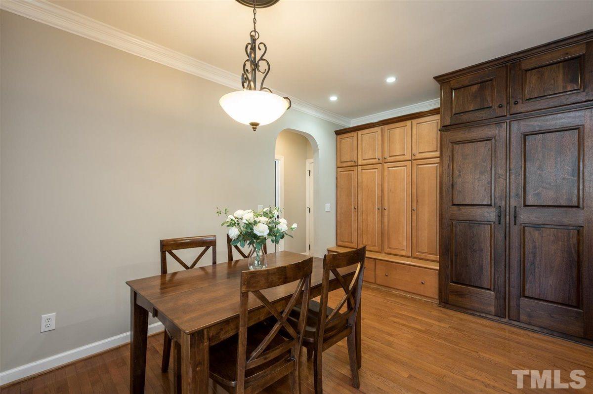 3100 Pyxis Court Raleigh, NC 27614 - Photo 26 of 30 The owner built this space to keep everything neat and organized. Behind the doors are 4 lockers for jackets, backpacks, and shoes. The dark wood doors are the custom built organized pantry with gliding shelves.
