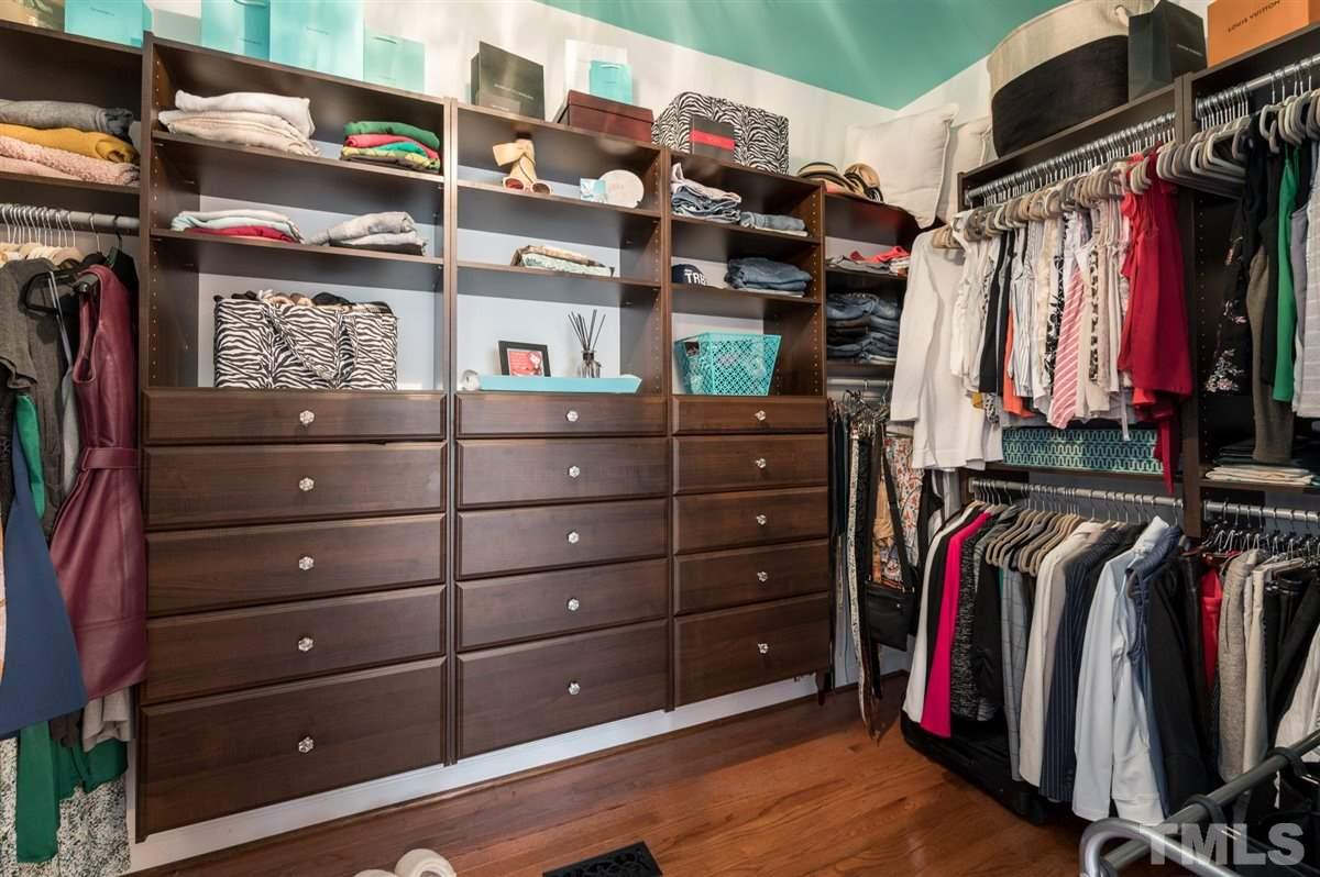3100 Pyxis Court Raleigh, NC 27614 - Photo 7 of 30 Custom designed walk in closet in the master bedroom. Two additional wall closets are located in the bedroom itself - perfect to hideaway suitcases and other personal items.