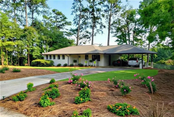 a front view of a house with garden
