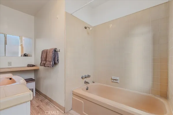a bathroom with a tub and a sink