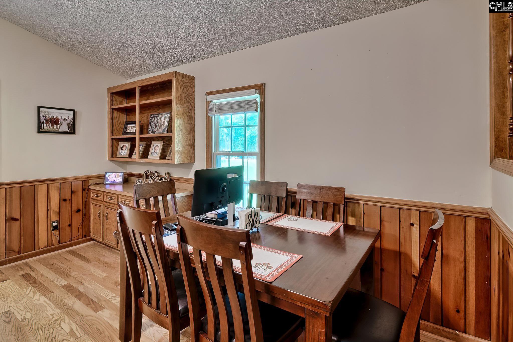 1415 State Rd S-28-55 Lugoff, SC 29078 - Photo 14 of 39 a view of a dining room with furniture and window