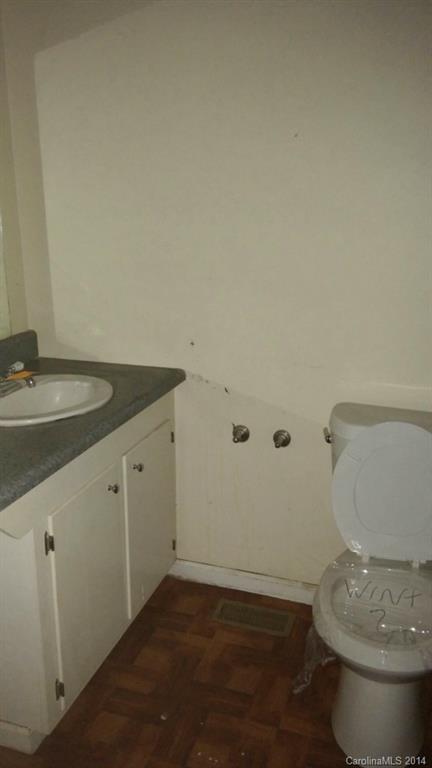 934 State Rd S-28-818 Elgin, SC 29045 - Photo 13 of 15 a bathroom with a granite countertop toilet and a sink