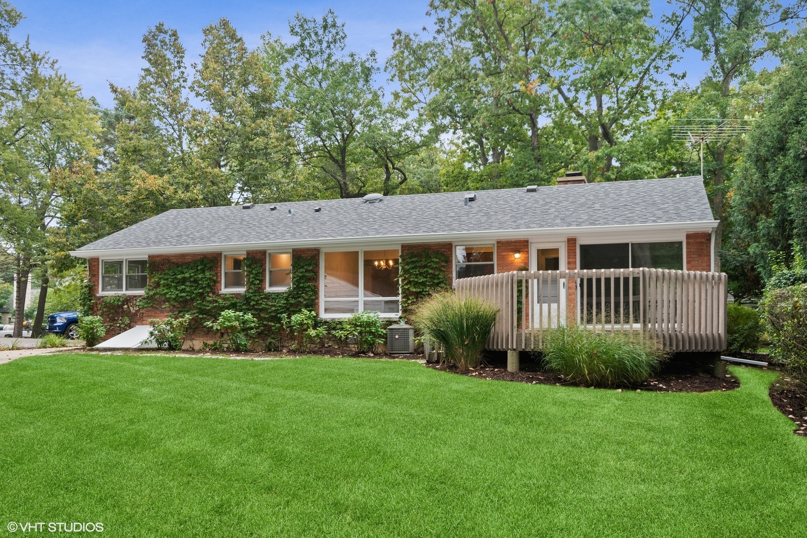 872 Northmoor Road Lake Forest, IL 60045 - Photo 19 of 23 a view of a house with a yard and potted plants