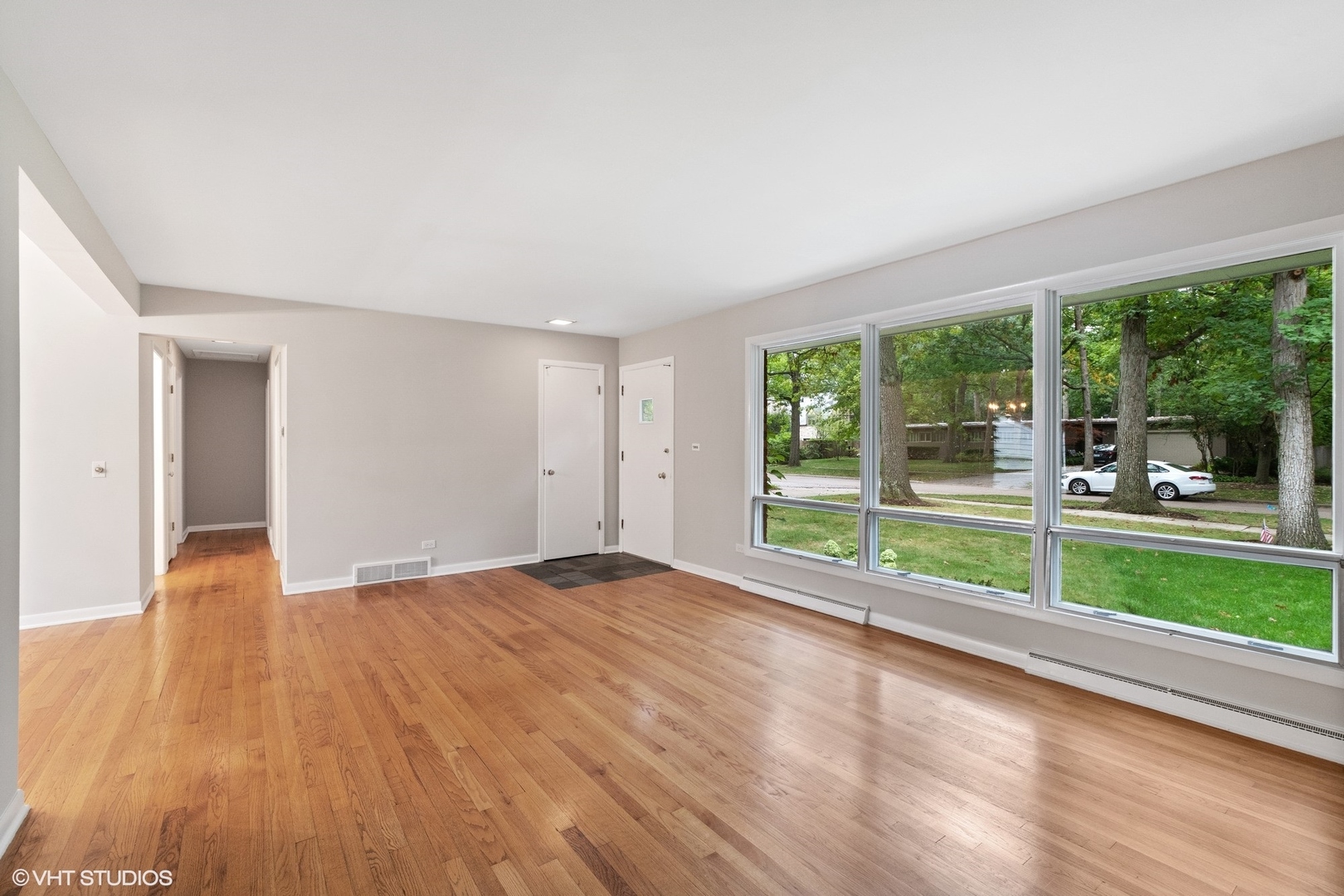 872 Northmoor Road Lake Forest, IL 60045 - Photo 6 of 23 a view of empty room with wooden floor and large window