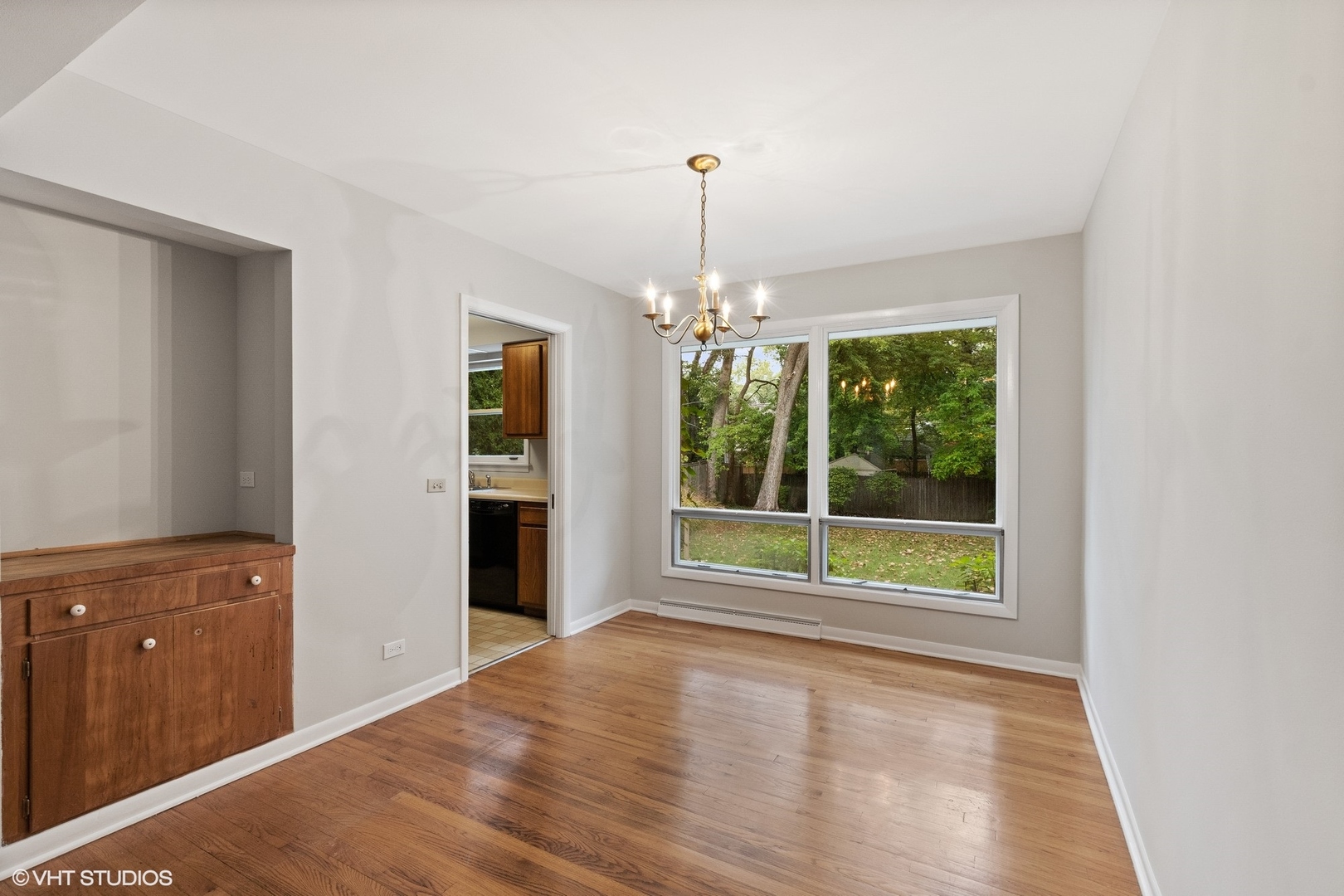 872 Northmoor Road Lake Forest, IL 60045 - Photo 7 of 23 a view of an empty room with a window and wooden floor