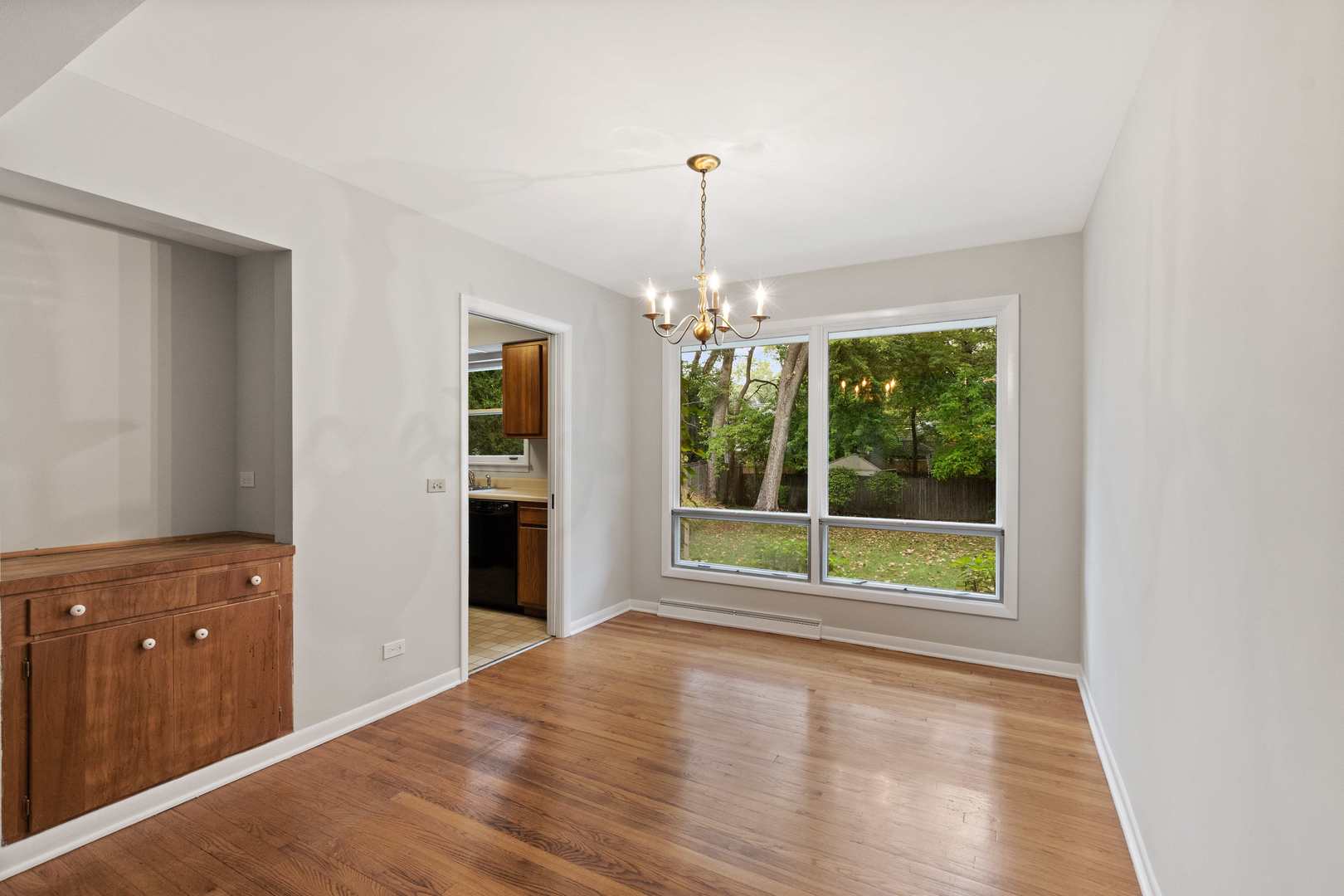872 Northmoor Road Lake Forest, IL 60045 - Photo 9 of 23 a view of a room with wooden floor fireplace and windows