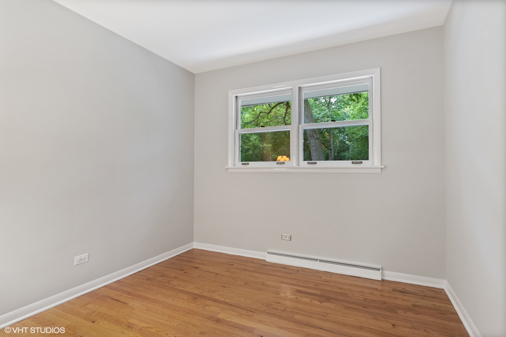 872 Northmoor Road Lake Forest, IL 60045 - Photo 10 of 23 an empty room with wooden floor and windows