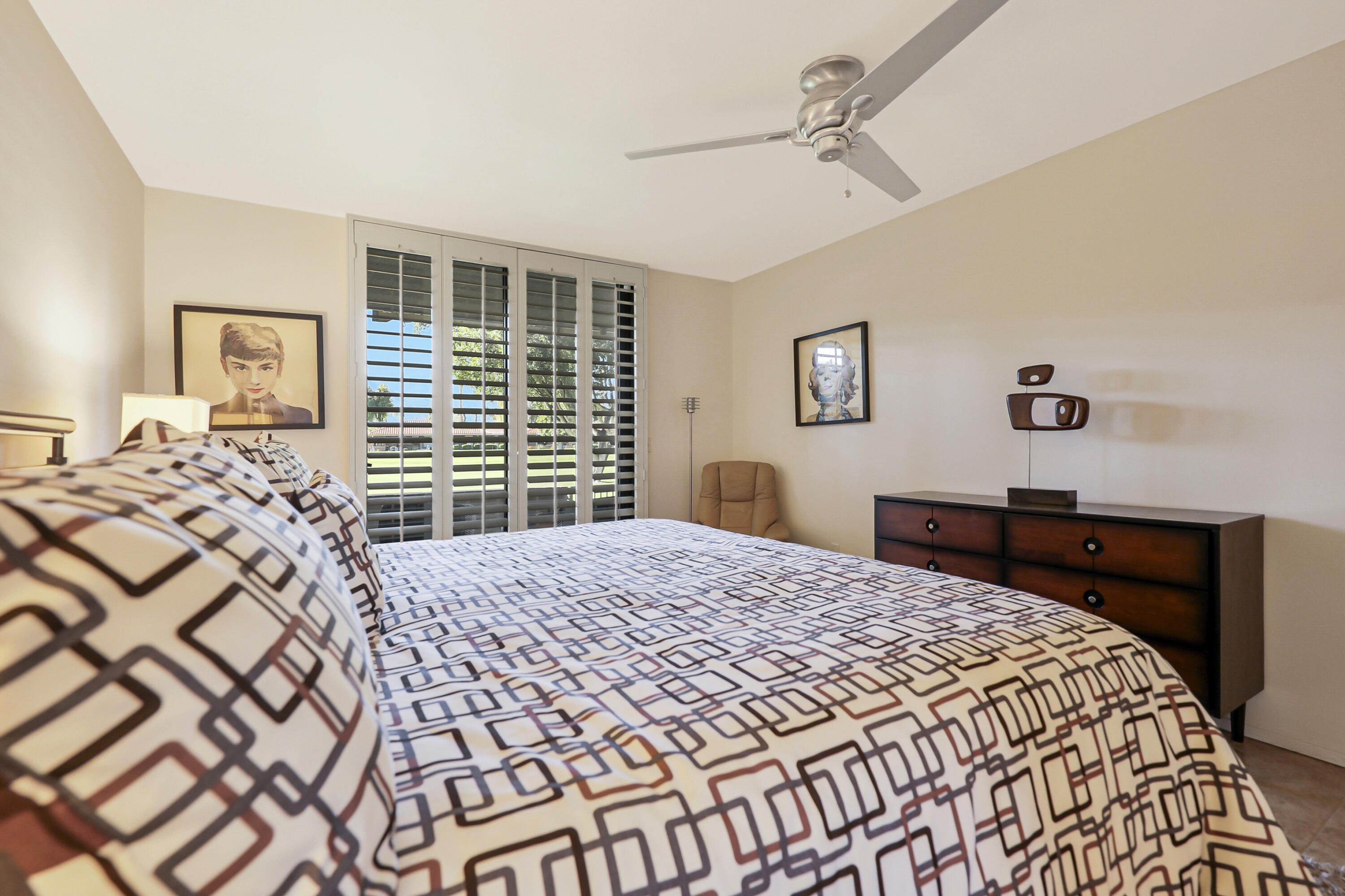 35 La Ronda Drive Rancho Mirage, CA 92270 - Photo 12 of 54 a bedroom with a bed and a dresser