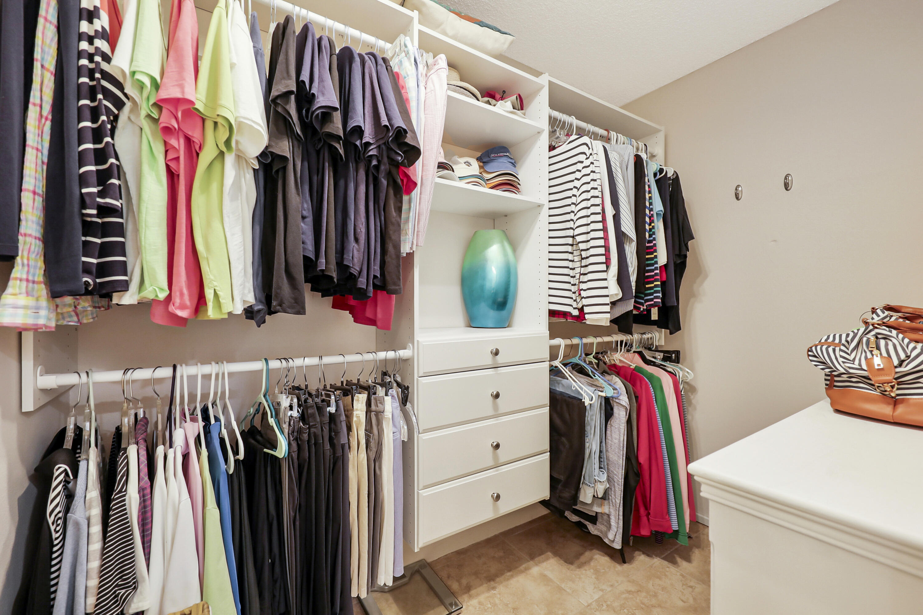 35 La Ronda Drive Rancho Mirage, CA 92270 - Photo 15 of 54 a view of walk in closet with clothes and shoes