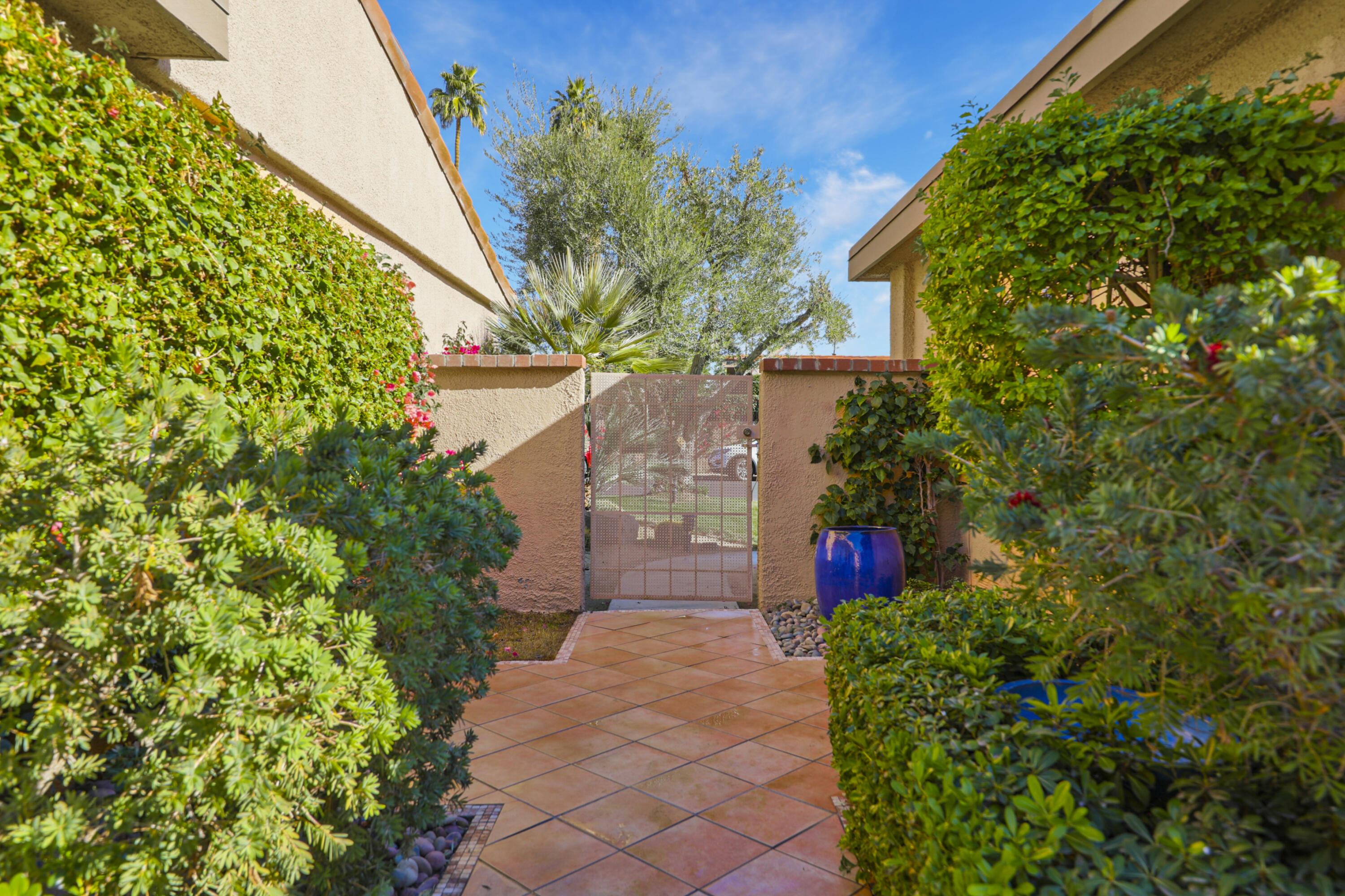 35 La Ronda Drive Rancho Mirage, CA 92270 - Photo 20 of 54 a view of a pathway in outside of the house