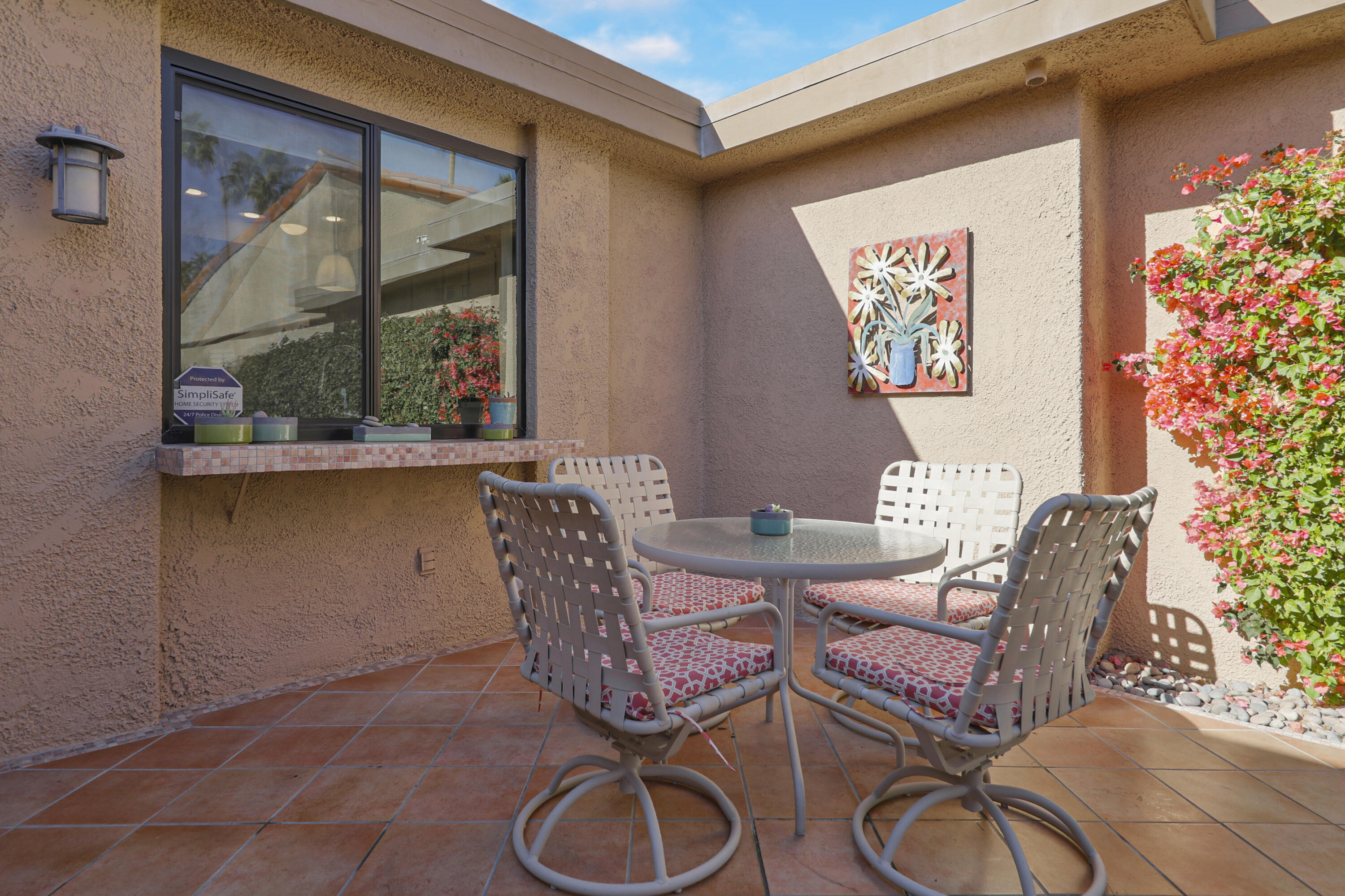35 La Ronda Drive Rancho Mirage, CA 92270 - Photo 22 of 54 a living room with furniture and a potted plant