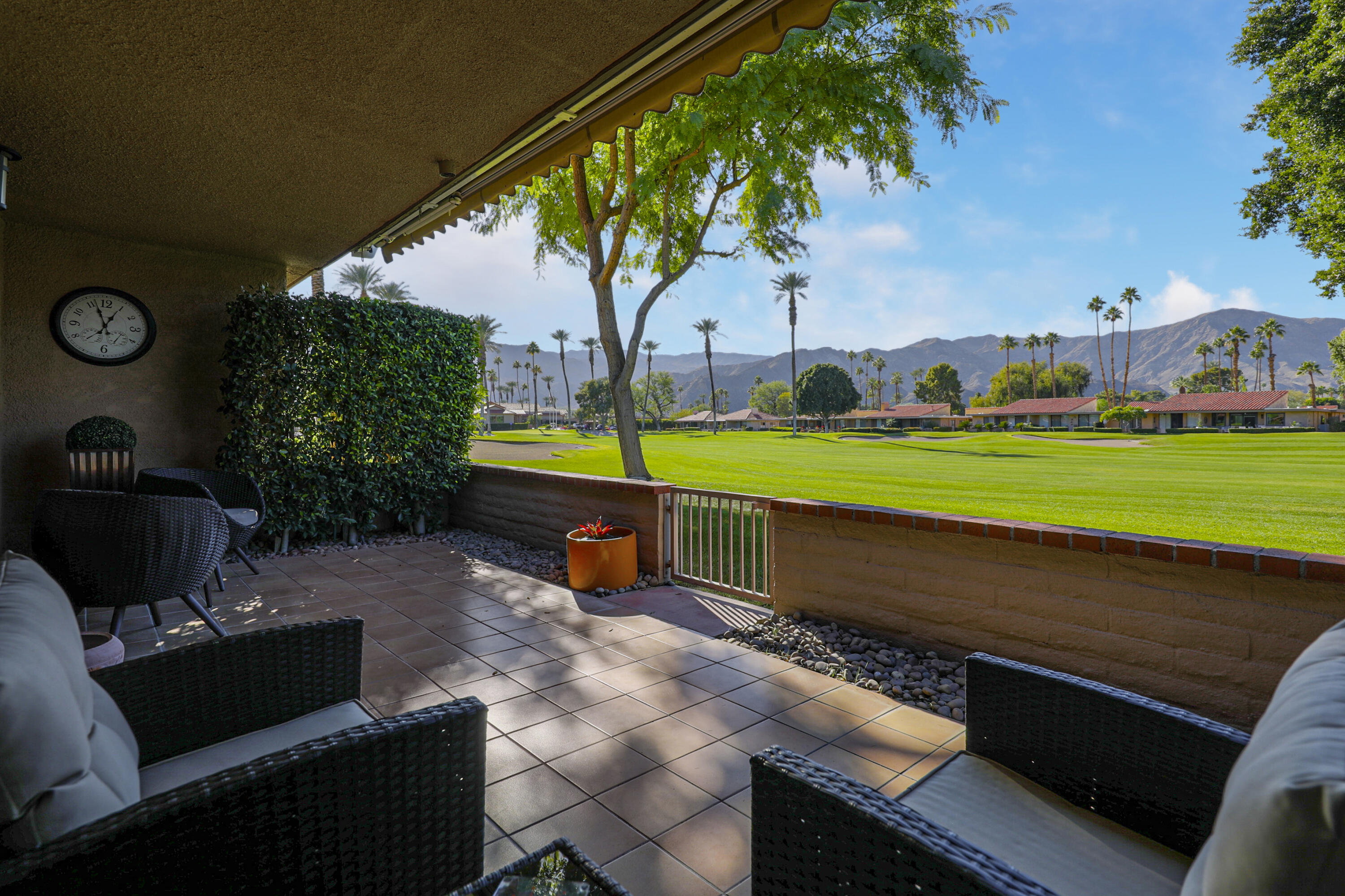 35 La Ronda Drive Rancho Mirage, CA 92270 - Photo 24 of 54 a view of a yard with furniture and a fire pit