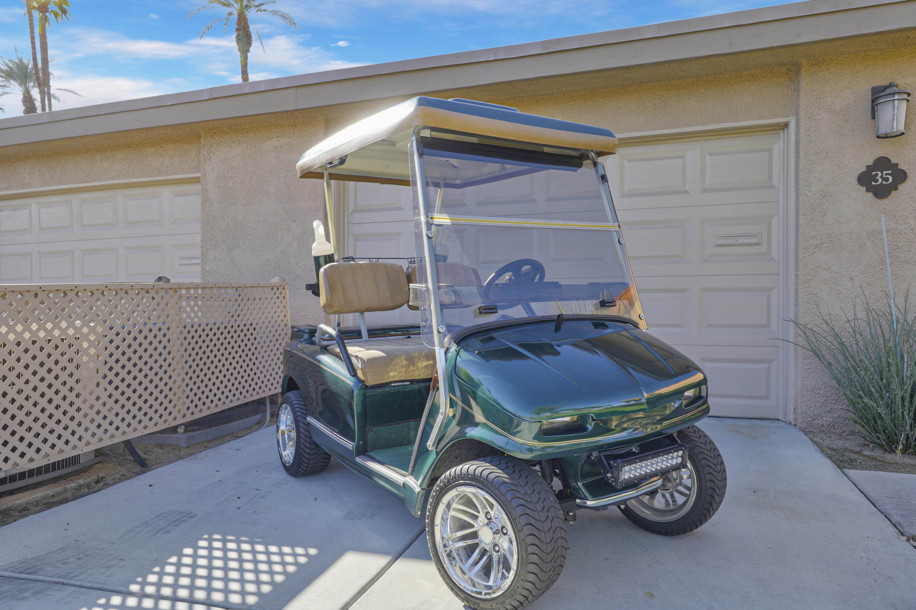 35 La Ronda Drive Rancho Mirage, CA 92270 - Photo 25 of 54 a car parked in front of a house