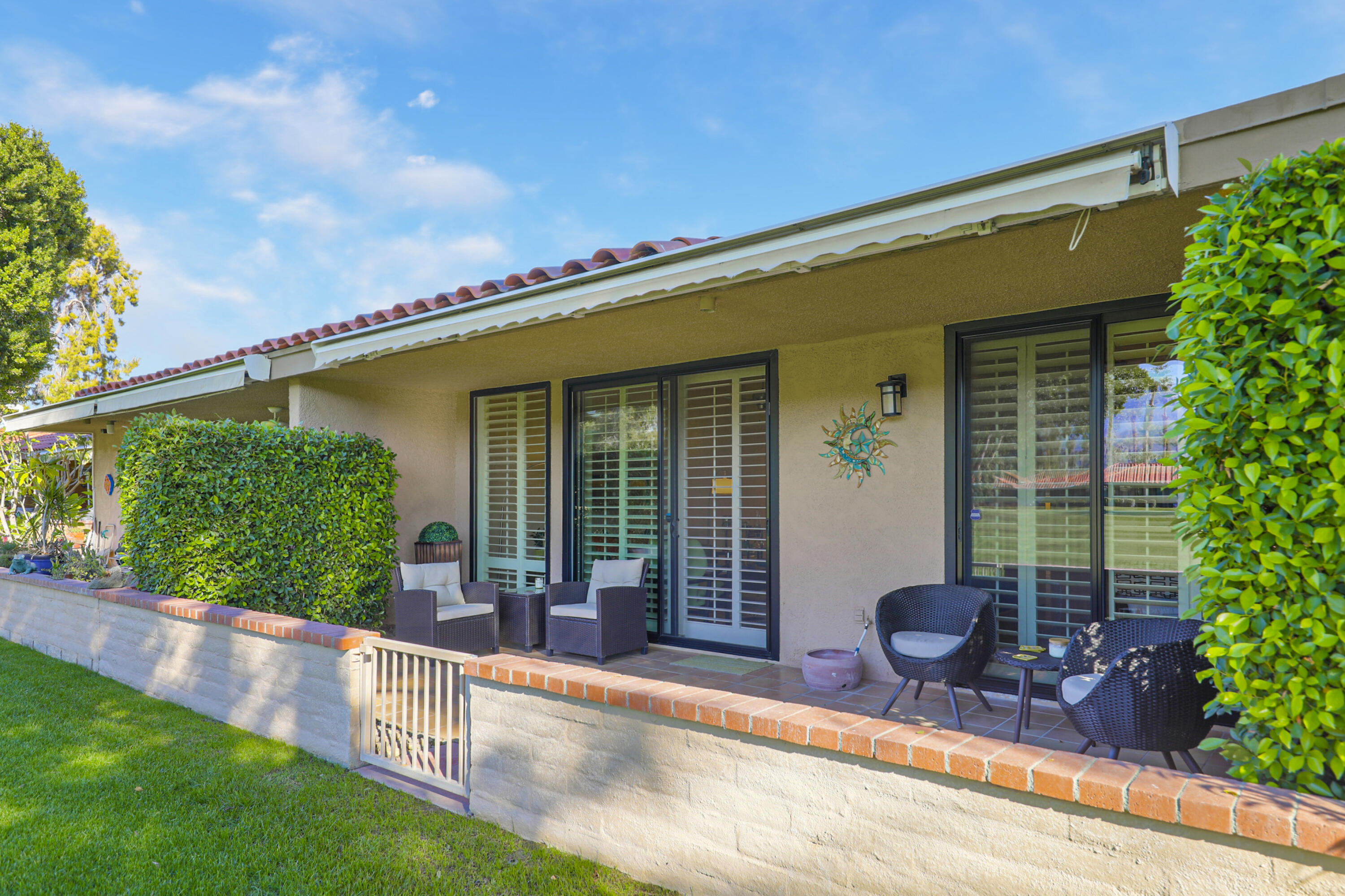 35 La Ronda Drive Rancho Mirage, CA 92270 - Photo 30 of 54 a view of house with backyard outdoor seating and green space