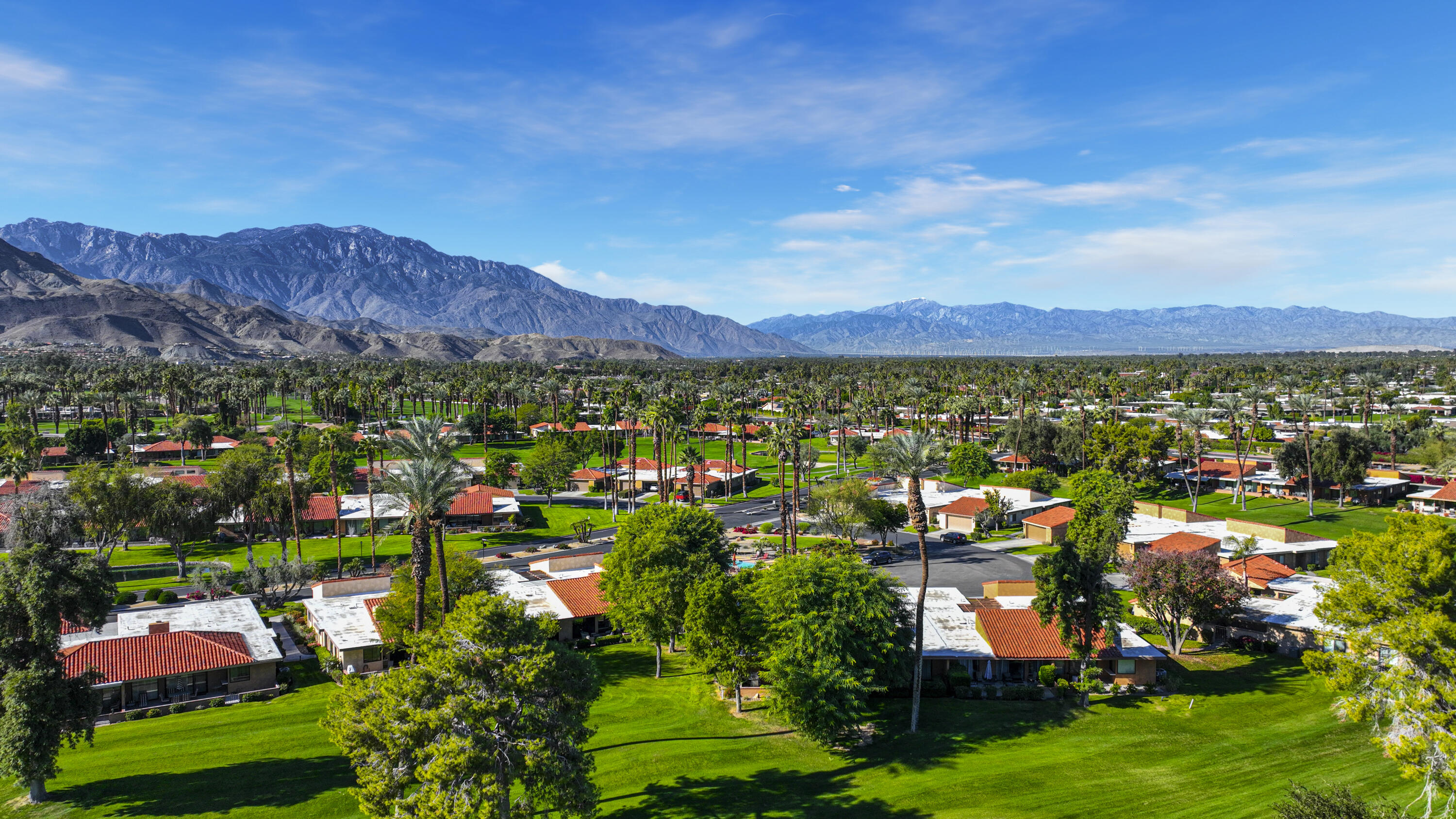 35 La Ronda Drive Rancho Mirage, CA 92270 - Photo 34 of 54 a view of lake and houses with outdoor space