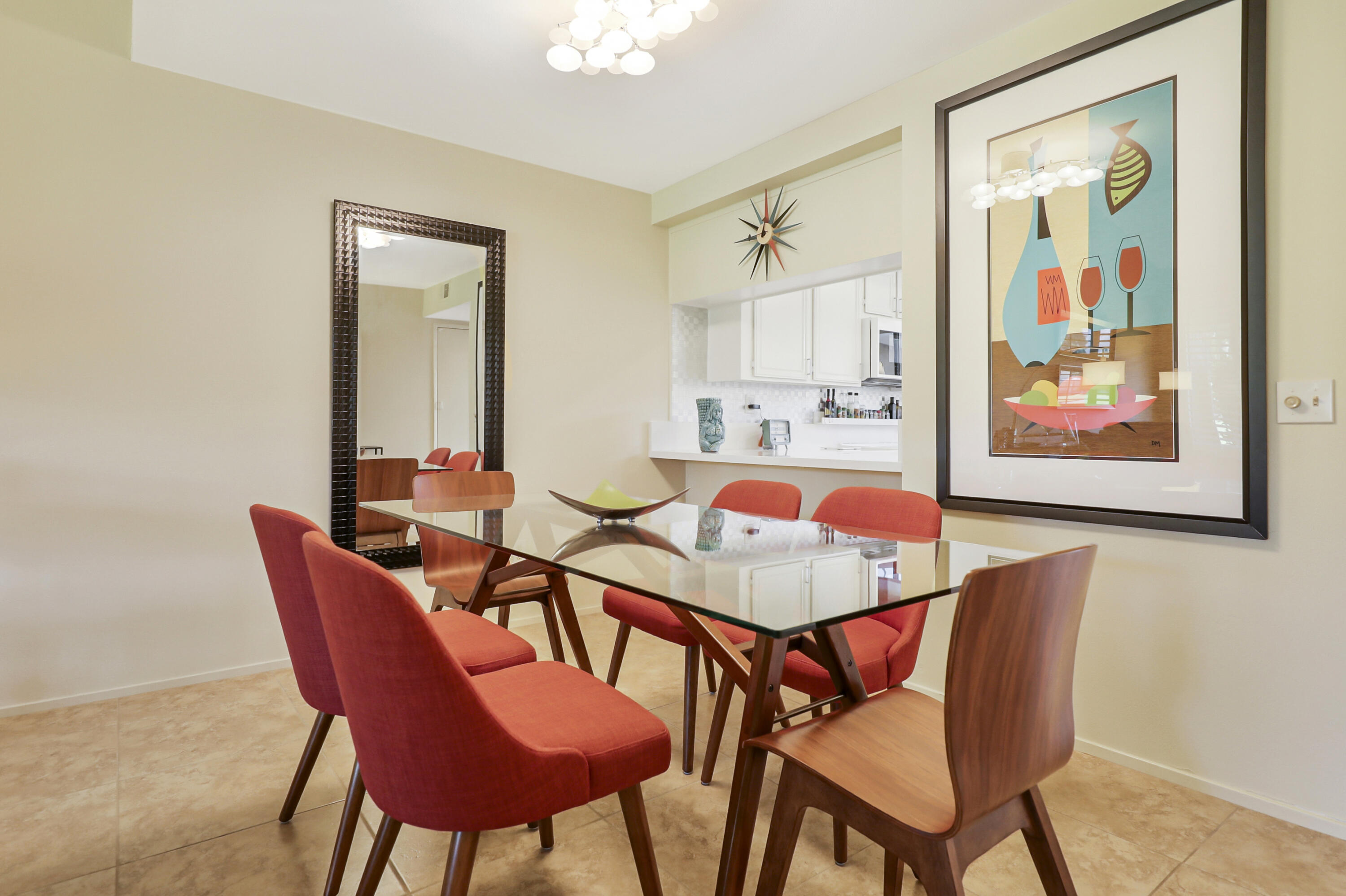 35 La Ronda Drive Rancho Mirage, CA 92270 - Photo 6 of 54 a view of a dining room with furniture and a potted plant