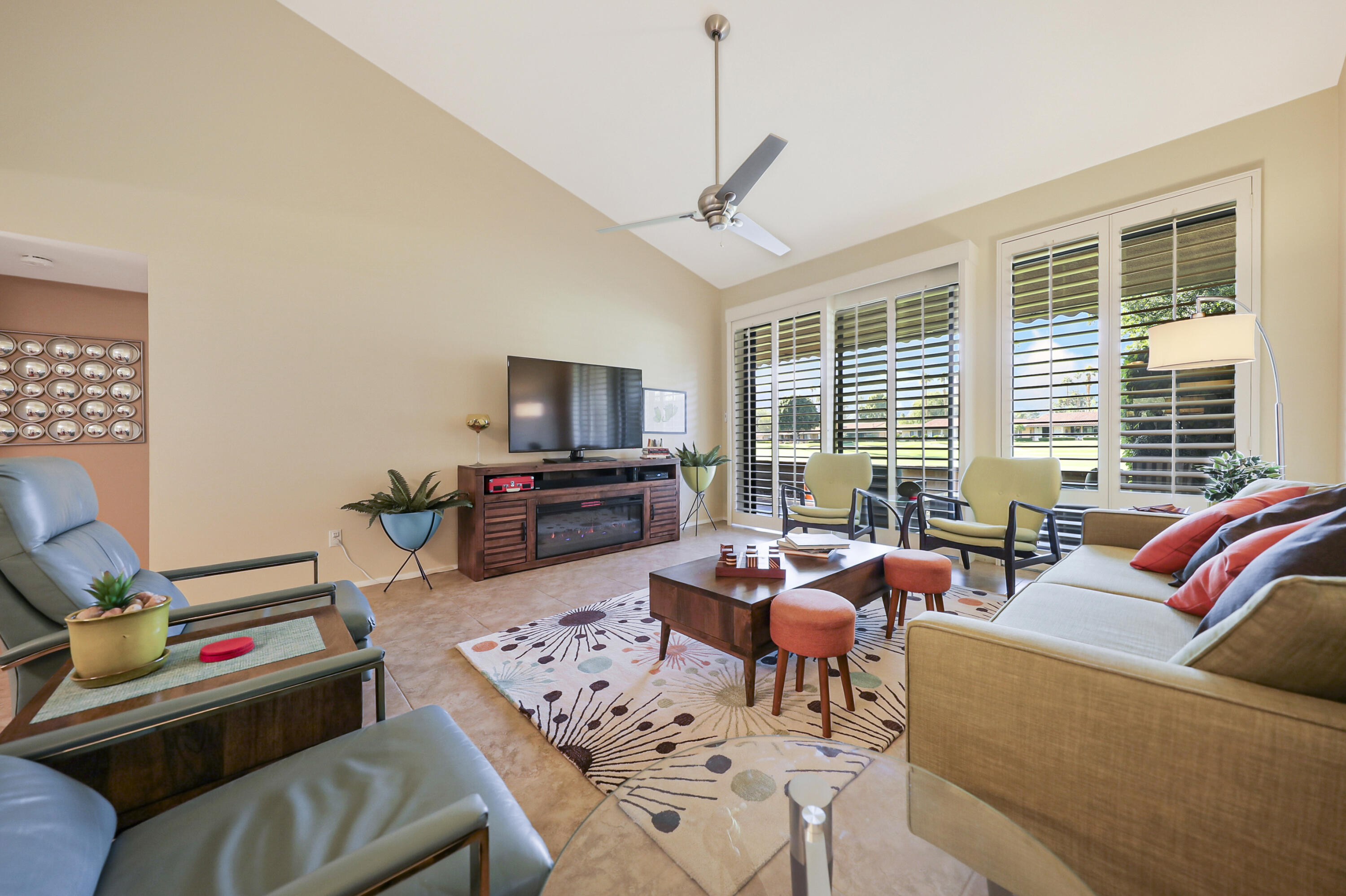 35 La Ronda Drive Rancho Mirage, CA 92270 - Photo 9 of 54 a living room with furniture and a flat screen tv