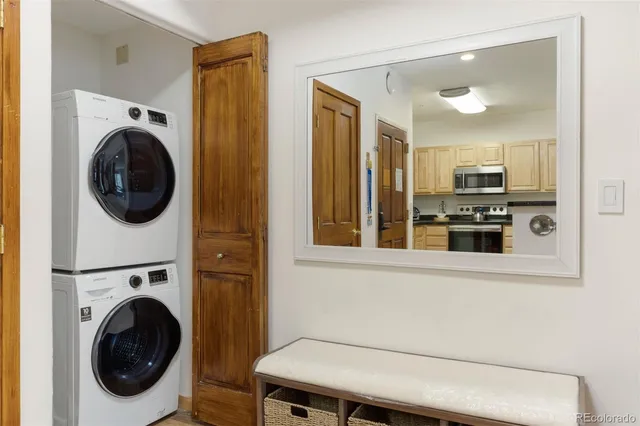 a view of a hallway with washer and dryer