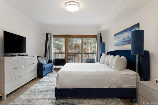 a bedroom with a bed and tv