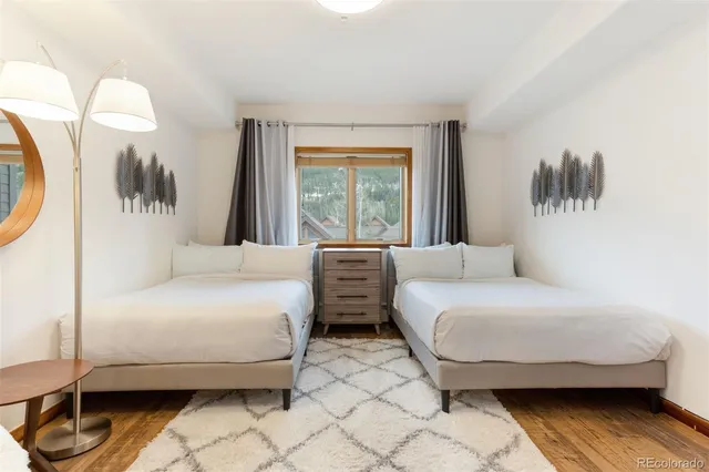 a bedroom with bed and a window