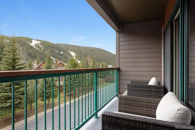 a view of balcony with furniture