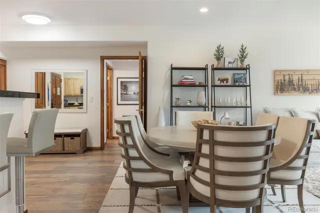 a view of a dining room with furniture and window