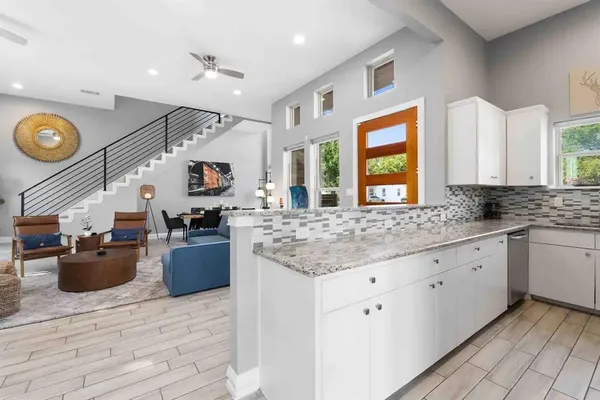 a kitchen with a stove and a sink