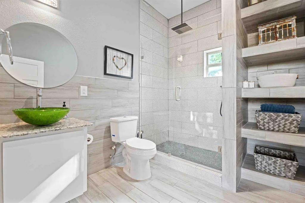 3807 Vilbig Road Dallas, TX 75212 - Photo 18 of 40 a bathroom with a sink toilet and shower