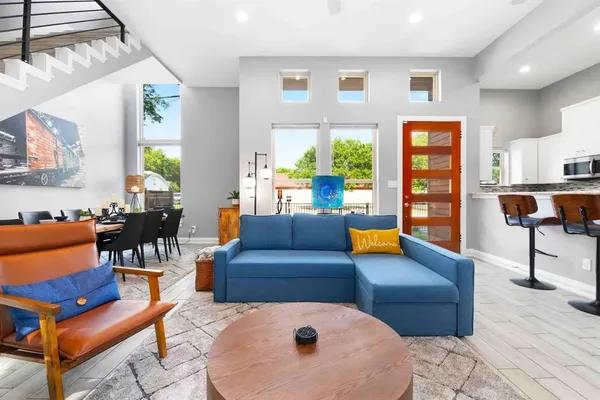 a living room with furniture and a large window