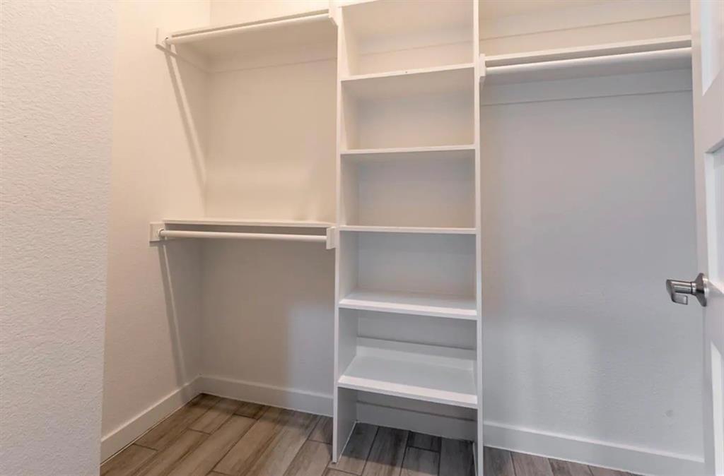 3807 Vilbig Road Dallas, TX 75212 - Photo 24 of 40 a view of walk in closet with empty racks