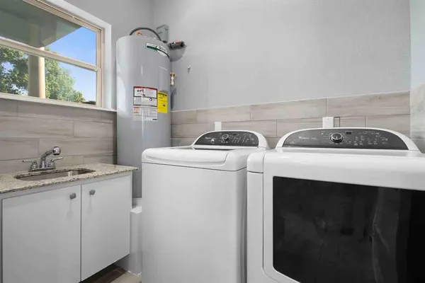 a utility room with dryer and washer