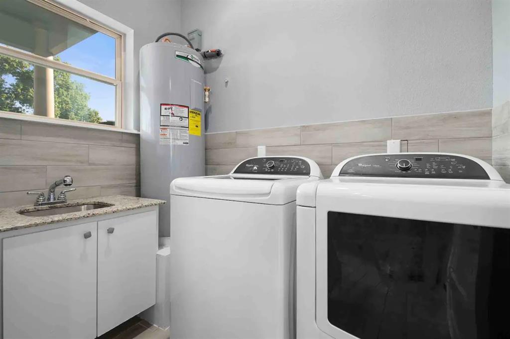 3807 Vilbig Road Dallas, TX 75212 - Photo 29 of 40 a utility room with dryer and washer