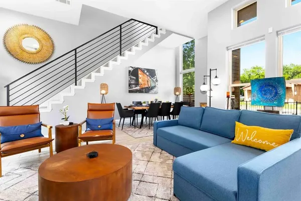 a living room with furniture and a clock